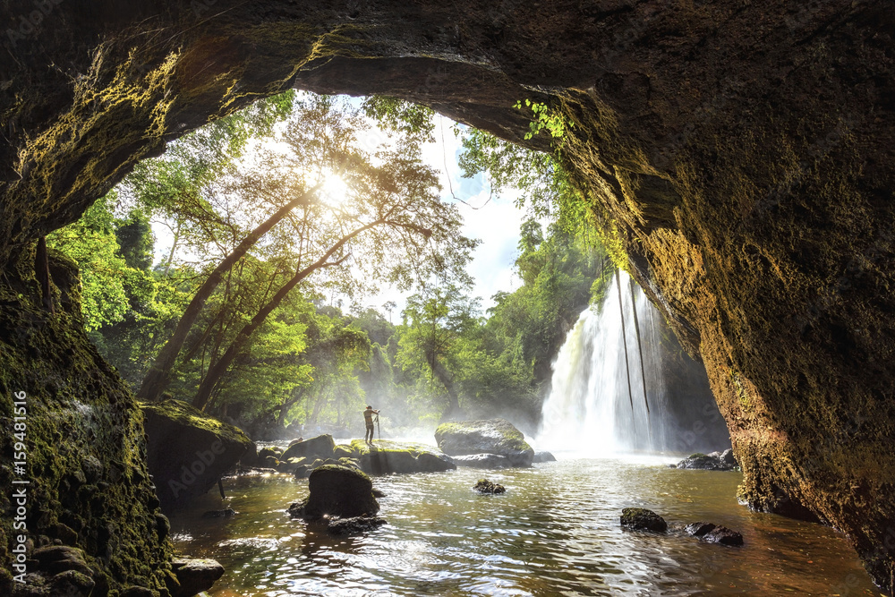 Fototapeta premium Professional landscape photographer with camera on tripod