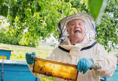 beekeeper with bees outdoor photo