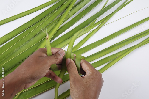 Making of Ketupat  a natural rice casing made from young coconut leaves for cooking rice