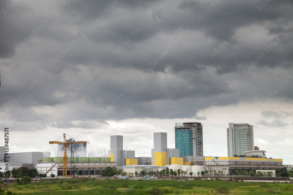 Power plant in the city and have The dark sky before rain will fall. Power plant in the city and have The dark sky before rain will fall.