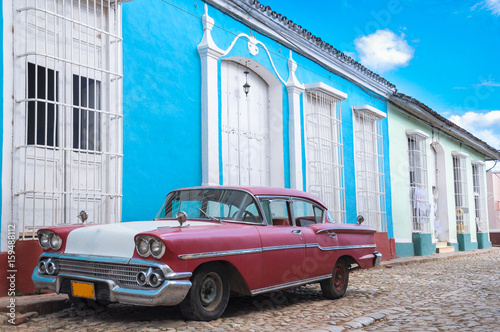 Photography Red iconic vintage car in Trinidad,Cuba