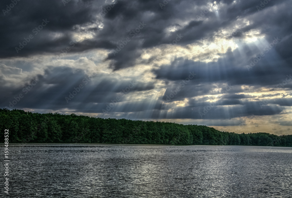 sun through clouds and pond sun through clouds and pond
