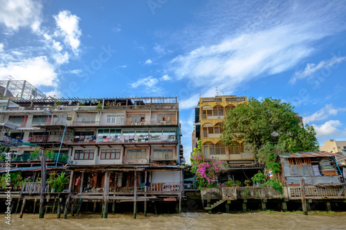 View of Chao Phraya River with blue sky and down-town Old colorful buildings in Bangkok, Thailand