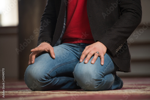 Close-Up Of Male Hands Praying In Mosque © Jale Ibrak