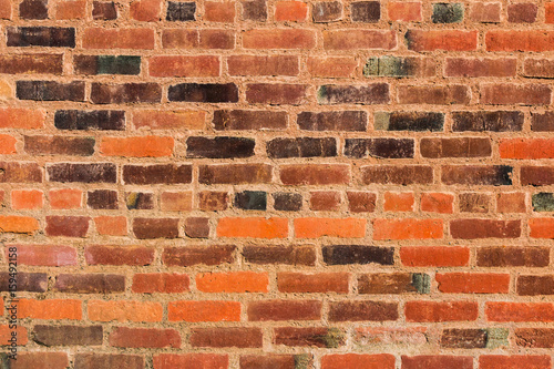 Wall With Different Colored Grunge Textured Bricks