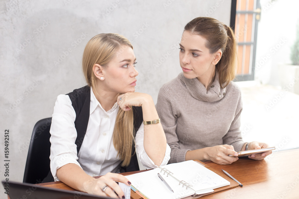 Young woman looking face and feeling unhappy with each other, buseness competitor concept. Young woman looking face and feeling unhappy with each other, buseness competitor concept.