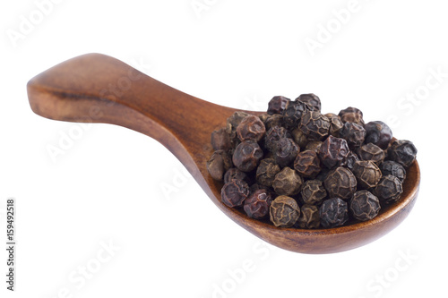 Black pepper in wooden spoon on white background.