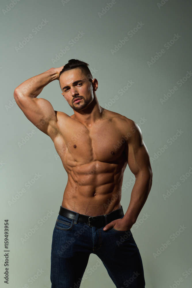 bodybuilder with muscular body in jeans