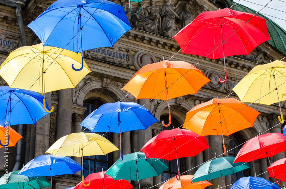 The sky of colorful umbrellas. Street with umbrellas.