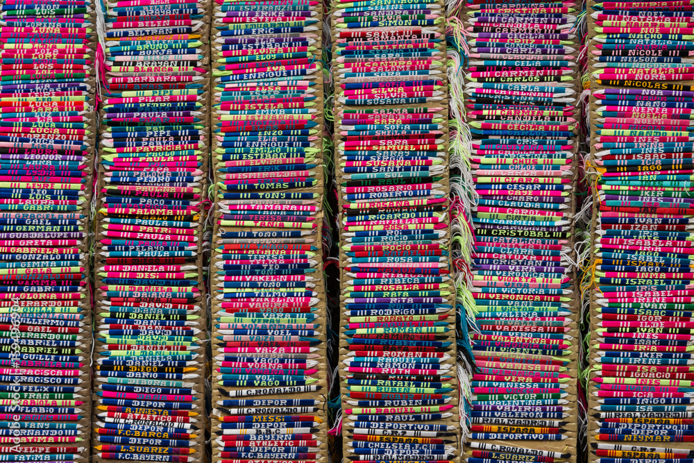 Colorful background of name embroidered bracelets in columns Colorful background of name embroidered bracelets in columns