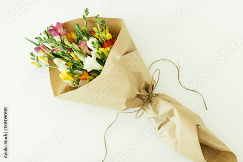 Bouquet wrapped in paper photo