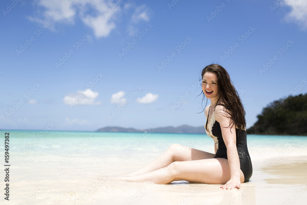 USA, Virgin Islands, Saint Thomas, Beautiful woman sitting on shore USA, Virgin Islands, Saint Thomas, Beautiful woman sitting on shore