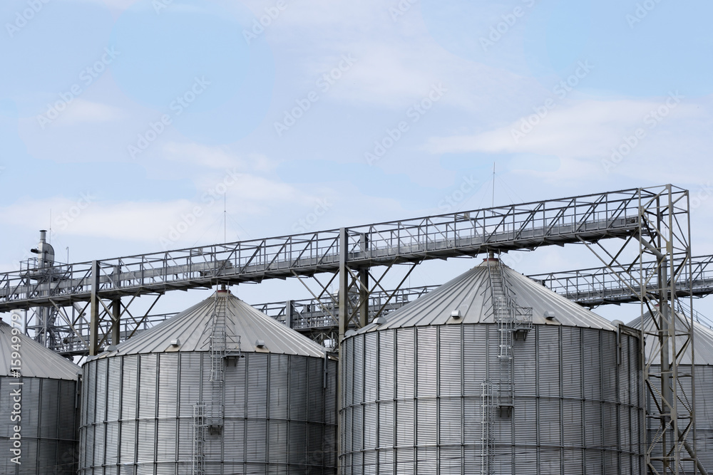 Elevators for storage of grain stocks against the blue sky Elevators for storage of grain stocks against the blue sky