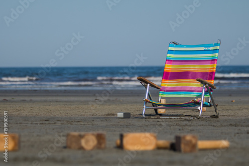 A colorful chair at the beach