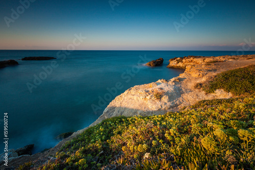 Beautiful long exposure seascape with sunrise or sunset.