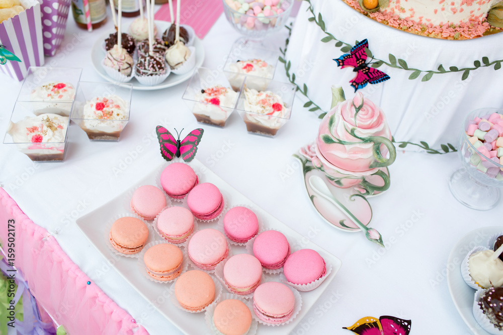 colorful birthday party table with cake colorful birthday party table with cake