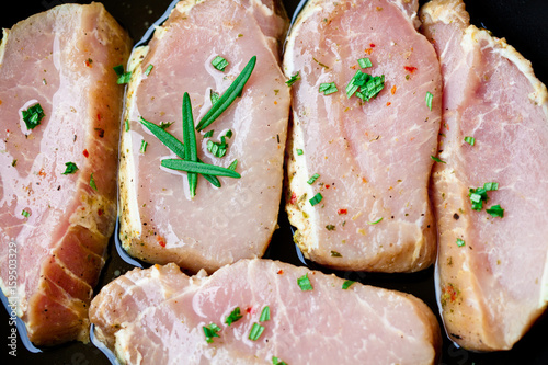Pork steaks with herbs, fresh fillets for grilling, baking. Raw organic meat. 