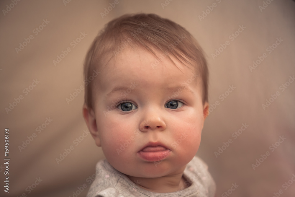 Cute serious baby girl portrait
