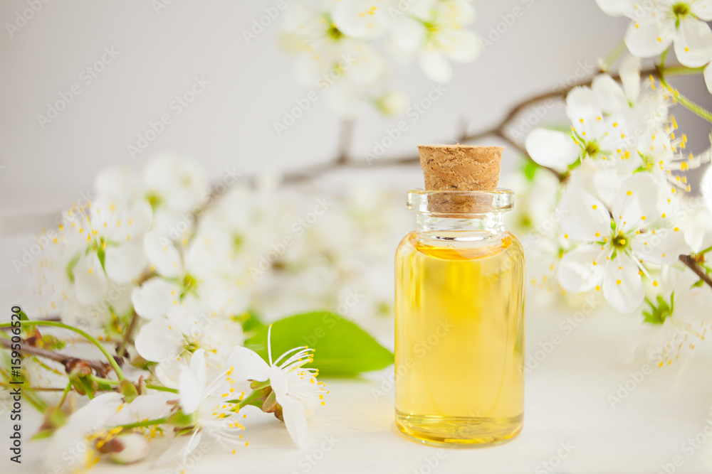 Essence of flowers on table in beautiful glass jar Essence of flowers on table in beautiful glass jar