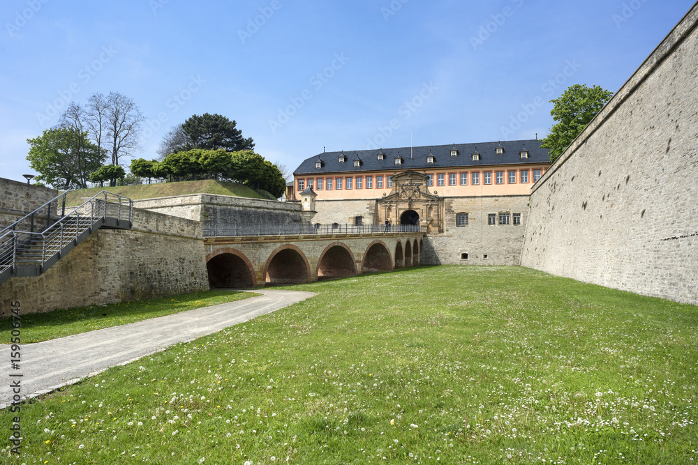 Germany, Thuringia, Erfurt, Zitadelle Petersberg, near dome, Petrini Street, Peterstor: Side view with green grass of gate and main entrance of citadel, 07 May 2017