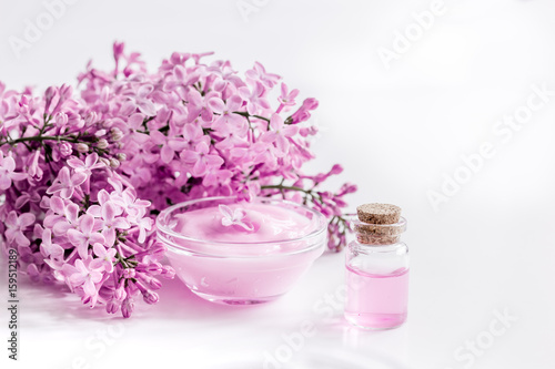 lilac natural cosmetic set for spa with cream white table background