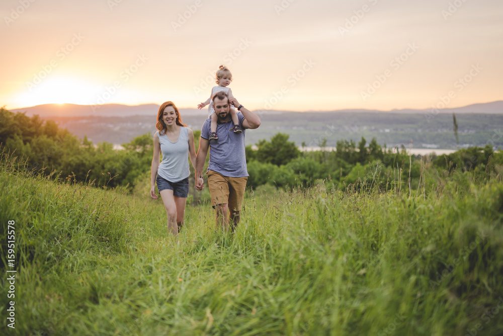 young father and mother with their cute daughter