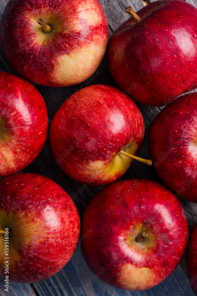 Seasonal. Autumn. Red apples on the rustic wooden surface Seasonal. Autumn. Red apples on the rustic wooden surface