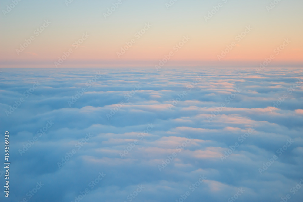 Photo of clouds seen from above on sunrise texture