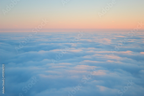 Photo of clouds seen from above on sunrise texture