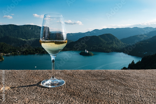 A glass of wine against the backdrop of Lake Bled, in Slovenia. Europe, otddyh, tourism.