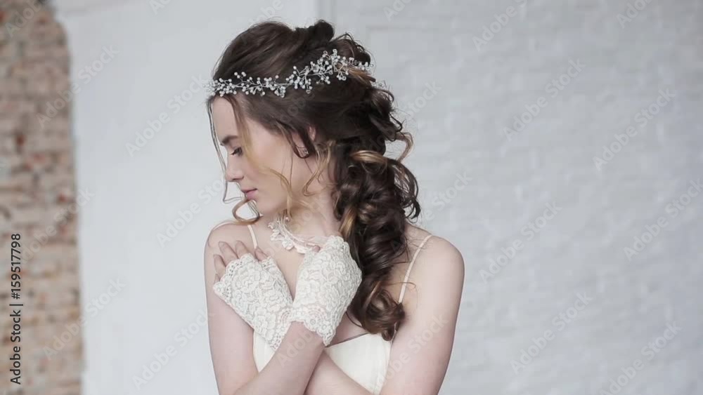 Brunette bride in fashion white wedding dress with makeup Brunette bride in fashion white wedding dress with makeup