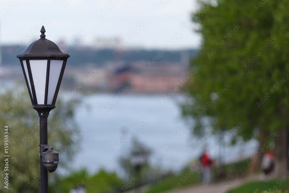 CCTV surveillance camera mounted on vintage street lantern