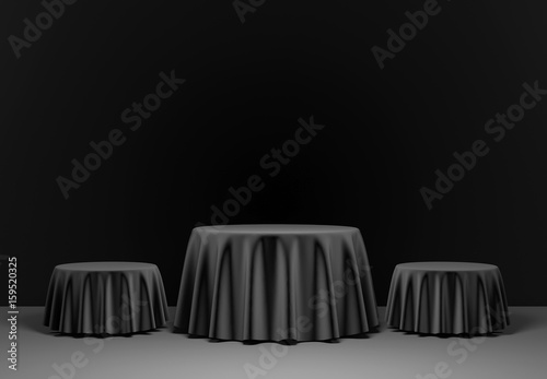 Three black round podium in the scene. 3d render