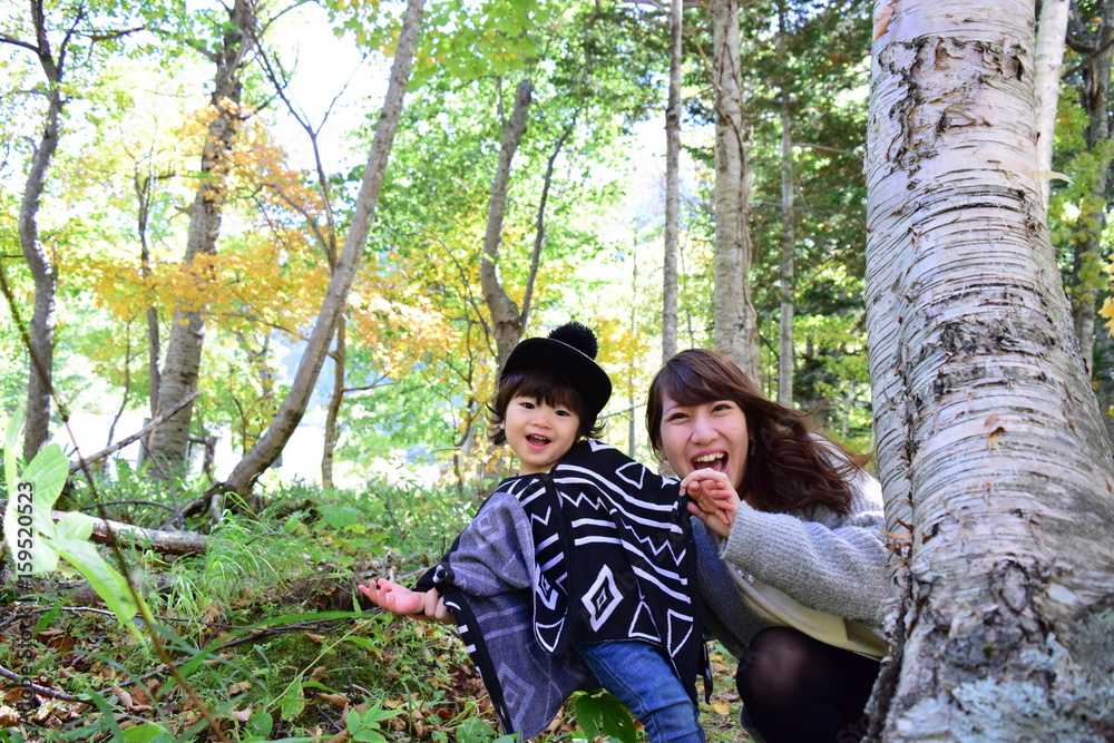 young japanese mother is playing with her son