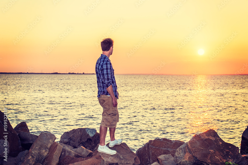 Young Man Watching Sunset