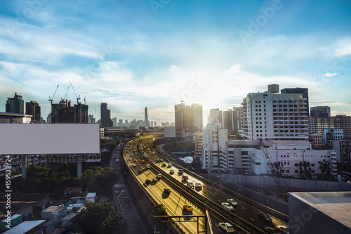 road traffic transportation and city in bangkok at twilight sunray and white big billboard