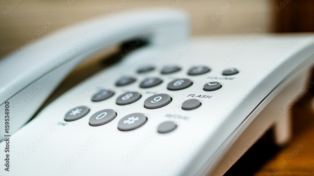 white telephone with grey dial buttons white telephone with grey dial buttons