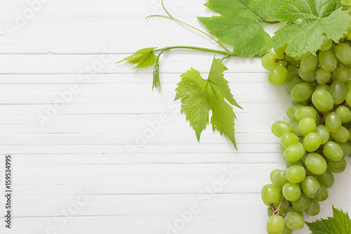 green grape on white wooden background
