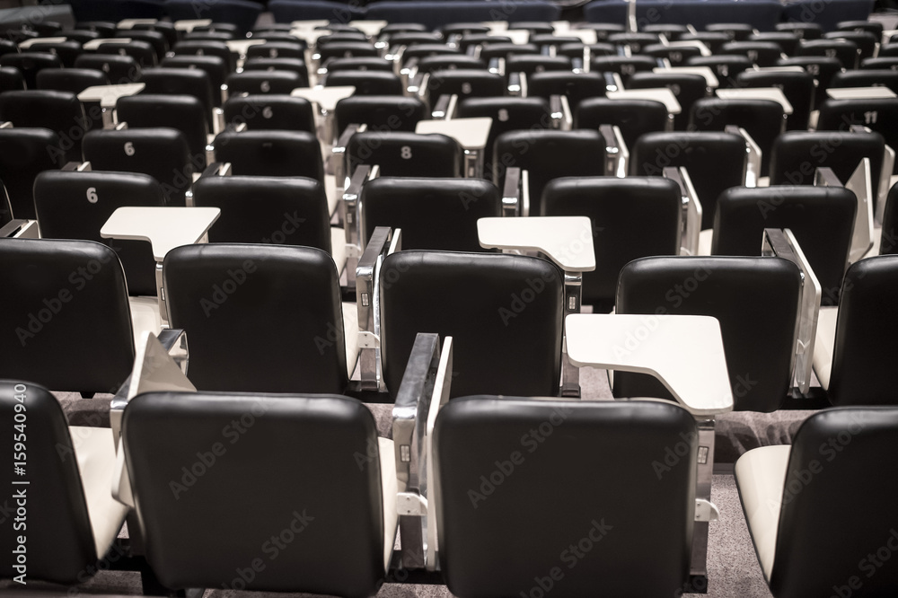 Fototapeta premium Backs of empty seats in auditorium