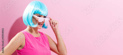 Portrait of a woman in a bright blue wig