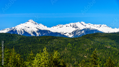 The Tantalus Mountain Range from a viewpoint along the Sea to Sky Highway between Squamish and Whistler with the snow covered peaks of Alpha Mountain, Serratus and Tantalus Mountain
