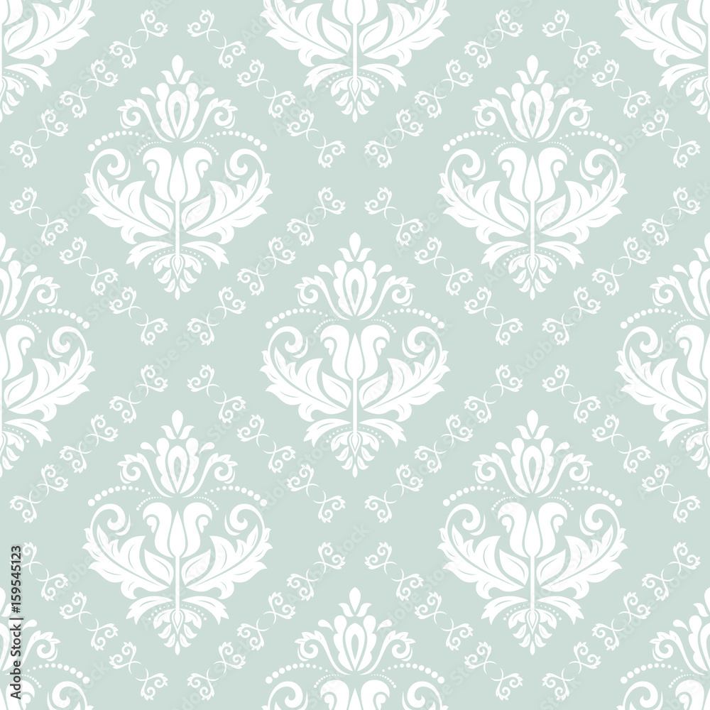 Damask classic light blue and white pattern. Seamless abstract background with repeating elements. Orient background Damask classic light blue and white pattern. Seamless abstract background with repeating elements. Orient background