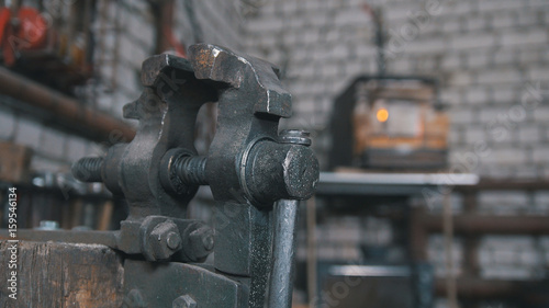 Inside forge workshop - steel vise, close up