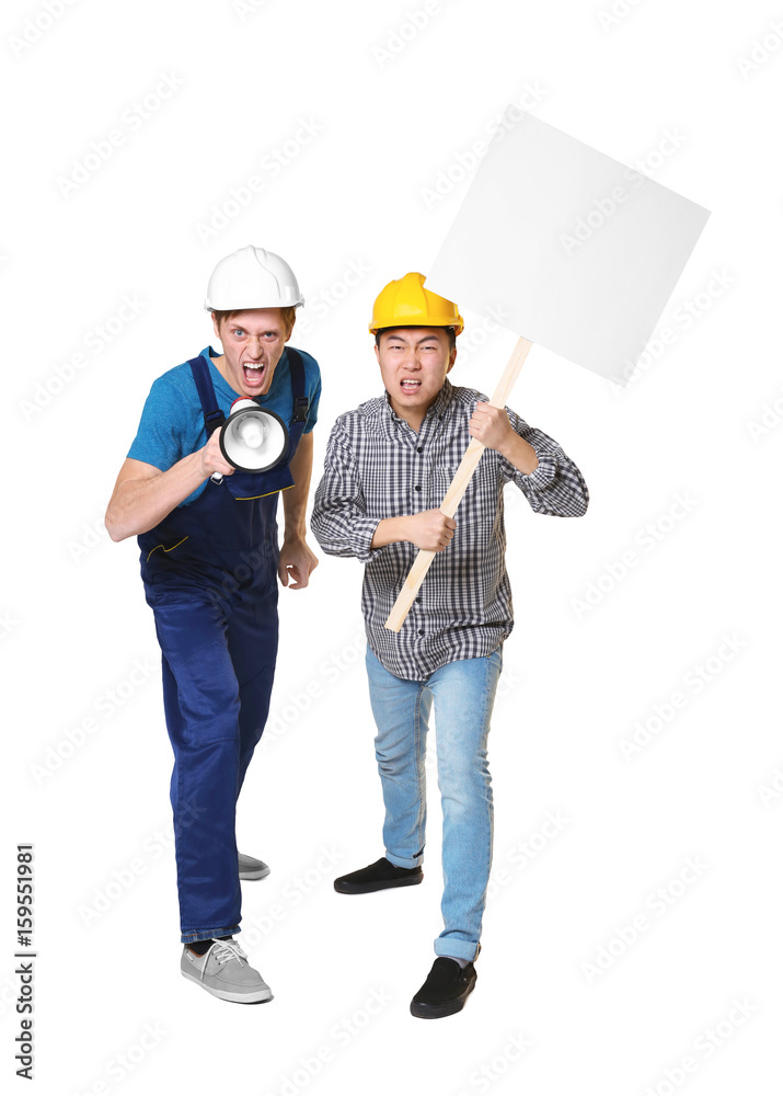Two protesting young men on light background Two protesting young men on light background