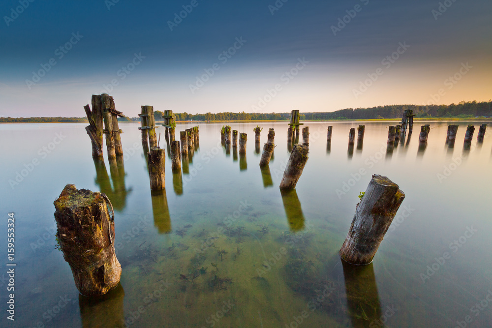 Long exposure landscape with pier and blue water