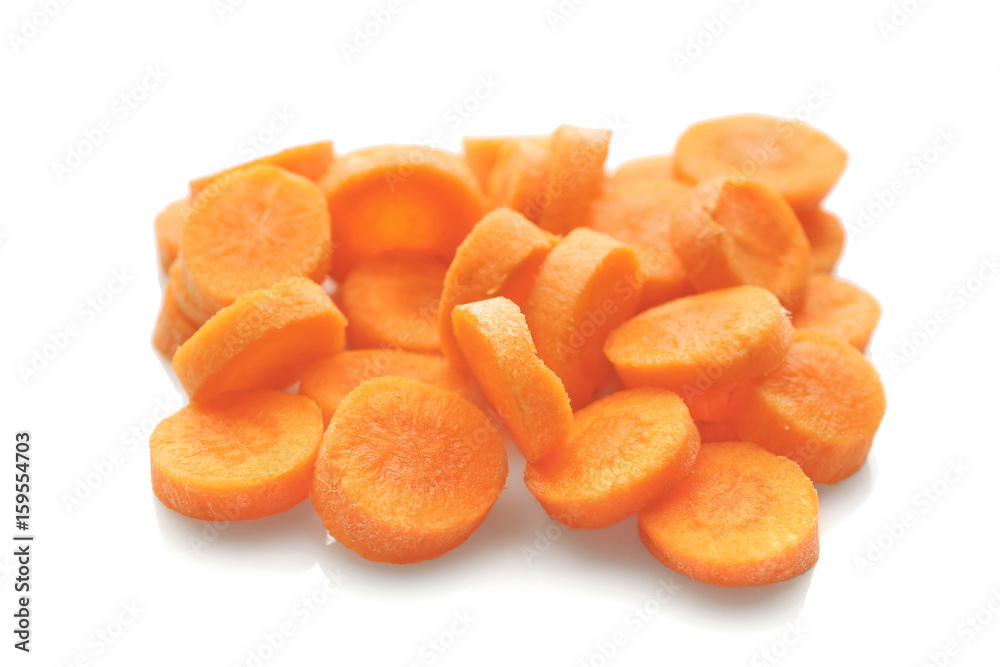 Heap of fresh carrot slices on white background Heap of fresh carrot slices on white background