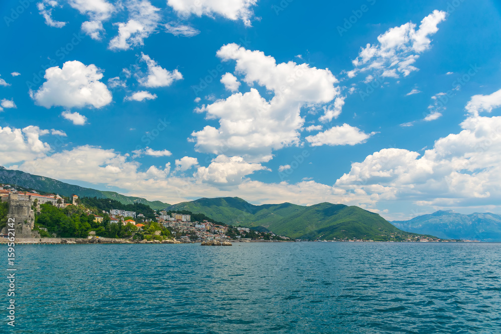 Obraz premium A sea yacht arrives to the city of Herceg Novi in Montenegro along the Adriatic Sea.