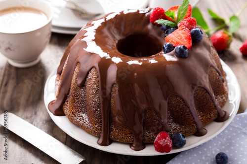 Chocolate bundt cake with berries photo