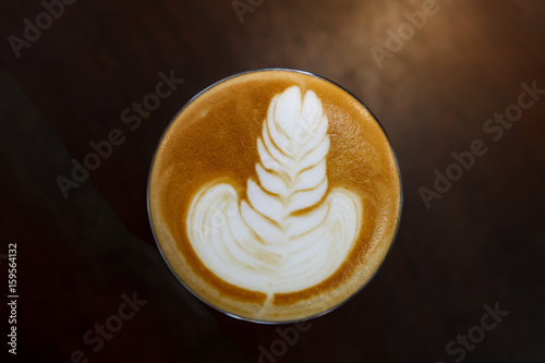 Coffee latte art in coffee shop in vintage color filter