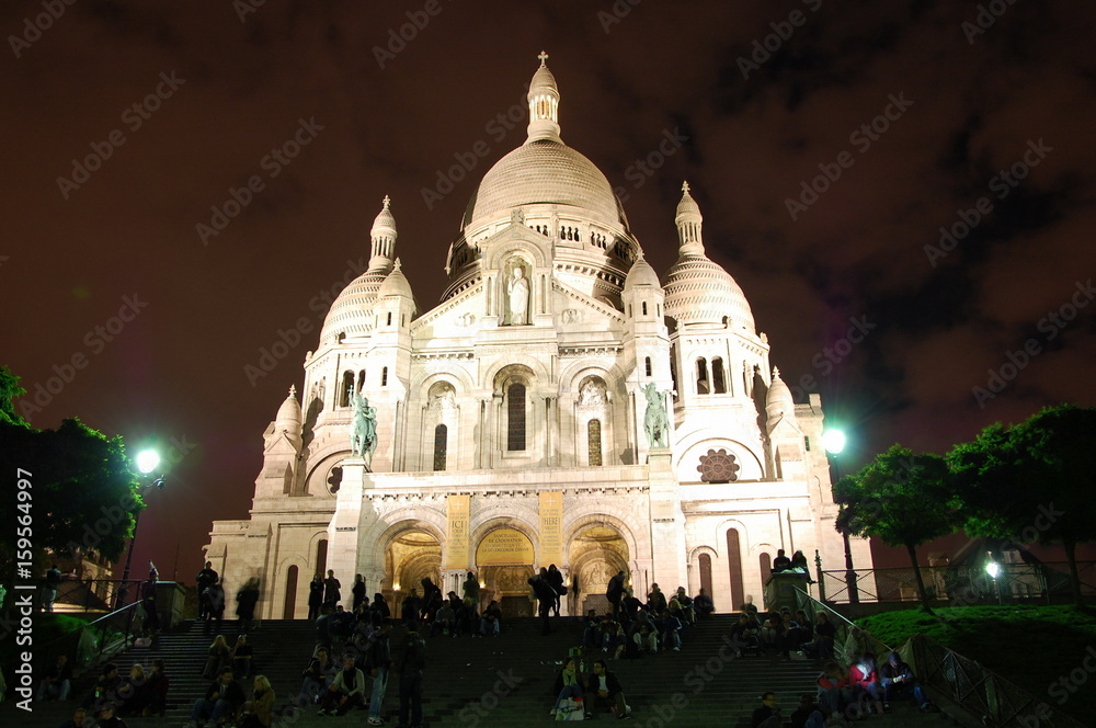 Night view of Basilica Sacre Coeur in Montmartre in Paris, France